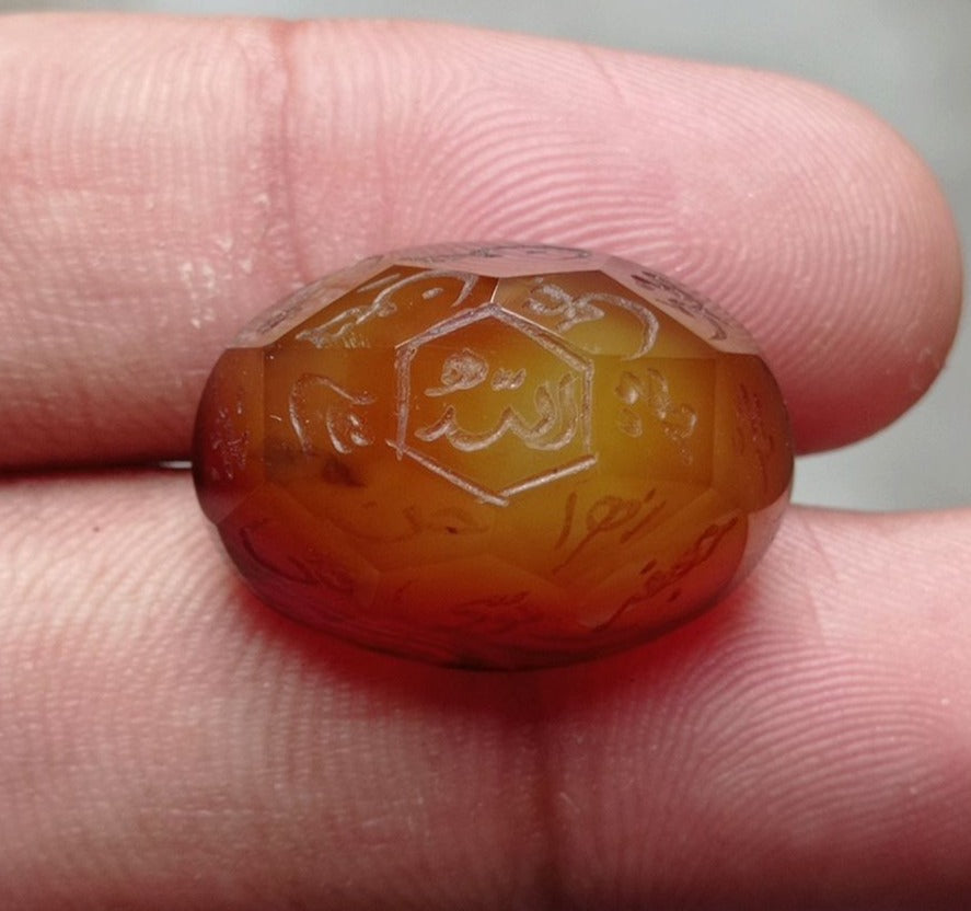 33.9ct Carnelian Carving - Engraved Aqeeq - 12 Imam Name - 23x17mm 33.9ct Carnelian Carving - Engraved Aqeeq - 12 Imam Name - 23x17mm