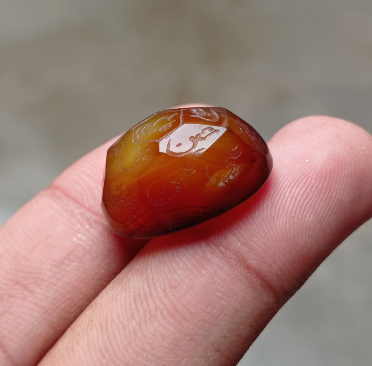 33.9ct Carnelian Carving - Engraved Aqeeq - 12 Imam Name - 23x17mm 33.9ct Carnelian Carving - Engraved Aqeeq - 12 Imam Name - 23x17mm