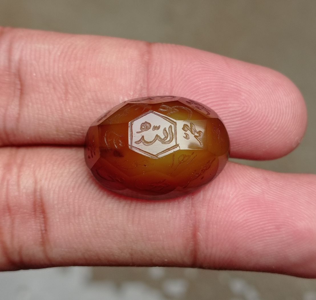 33.9ct Carnelian Carving - Engraved Aqeeq - 12 Imam Name - 23x17mm 33.9ct Carnelian Carving - Engraved Aqeeq - 12 Imam Name - 23x17mm