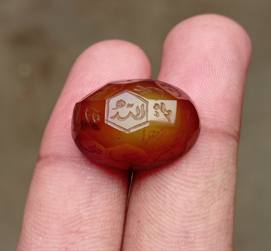 33.9ct Carnelian Carving - Engraved Aqeeq - 12 Imam Name - 23x17mm 33.9ct Carnelian Carving - Engraved Aqeeq - 12 Imam Name - 23x17mm