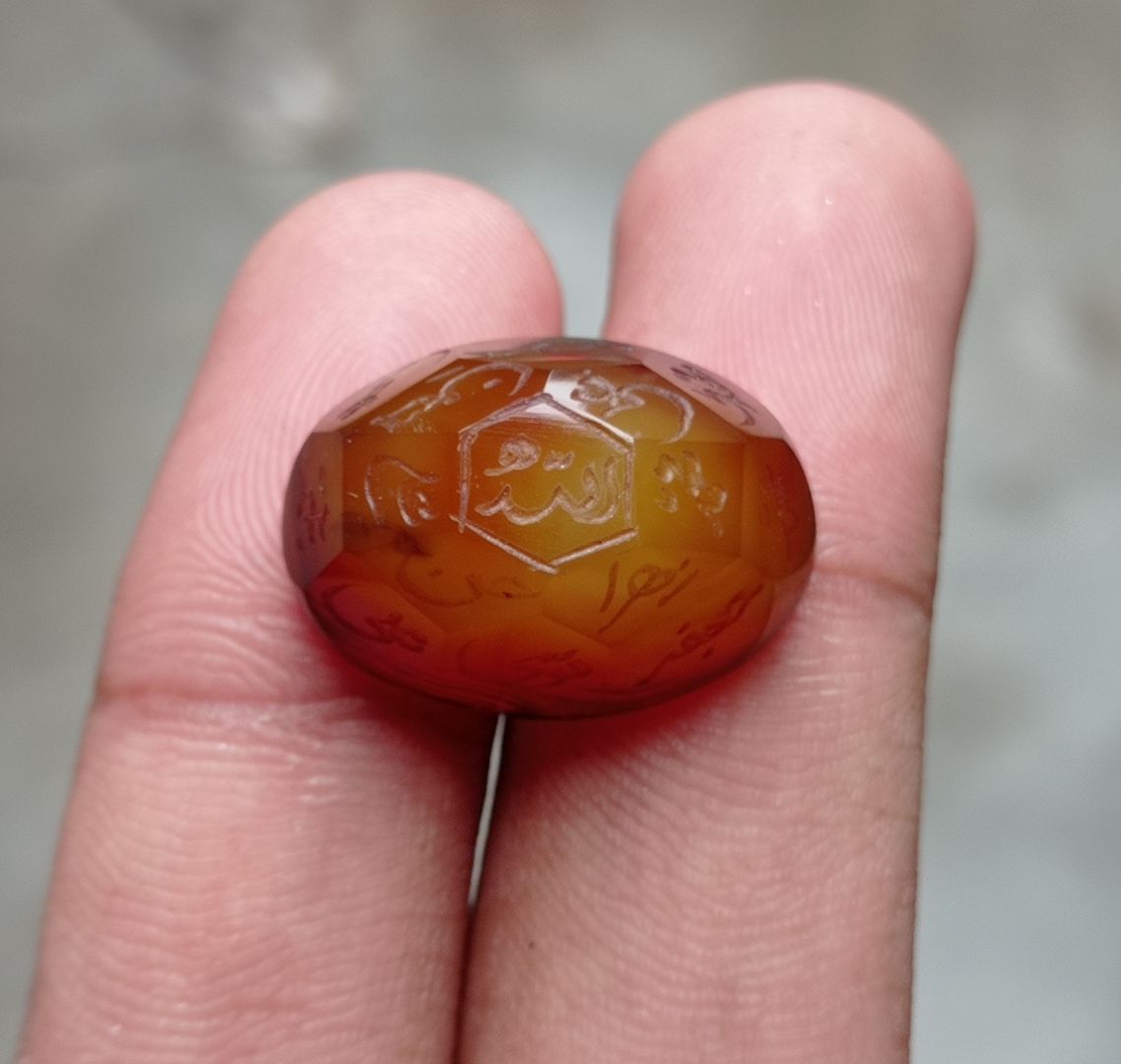 33.9ct Carnelian Carving - Engraved Aqeeq - 12 Imam Name - 23x17mm 33.9ct Carnelian Carving - Engraved Aqeeq - 12 Imam Name - 23x17mm
