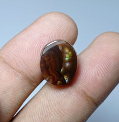 Мексиканский огненный агат овальной формы 8,4 карата — фиолетовый и зеленый огонь — размеры 15x12x5 мм